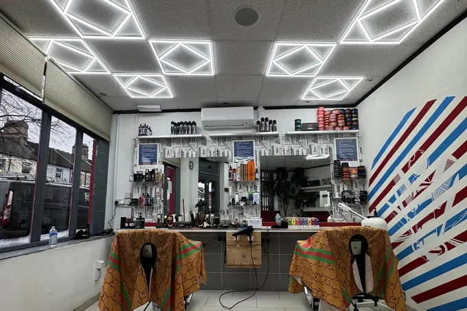 Barber shop with geometric LED ceiling lighting