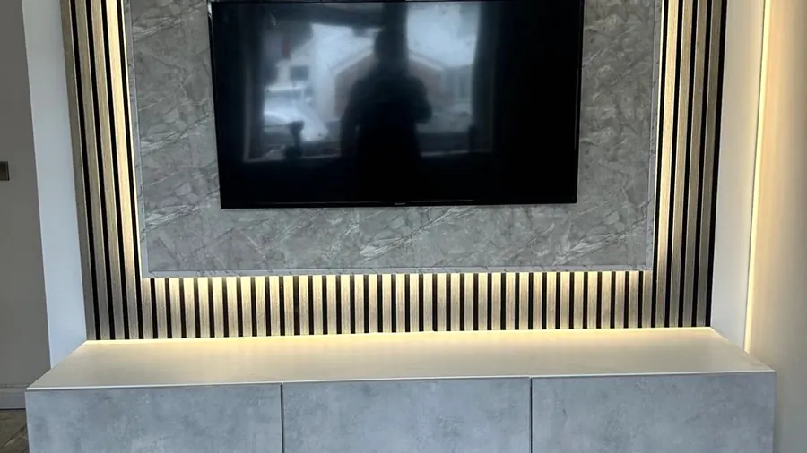 Media wall with backlit slats by Cann's Electrical, Cardiff